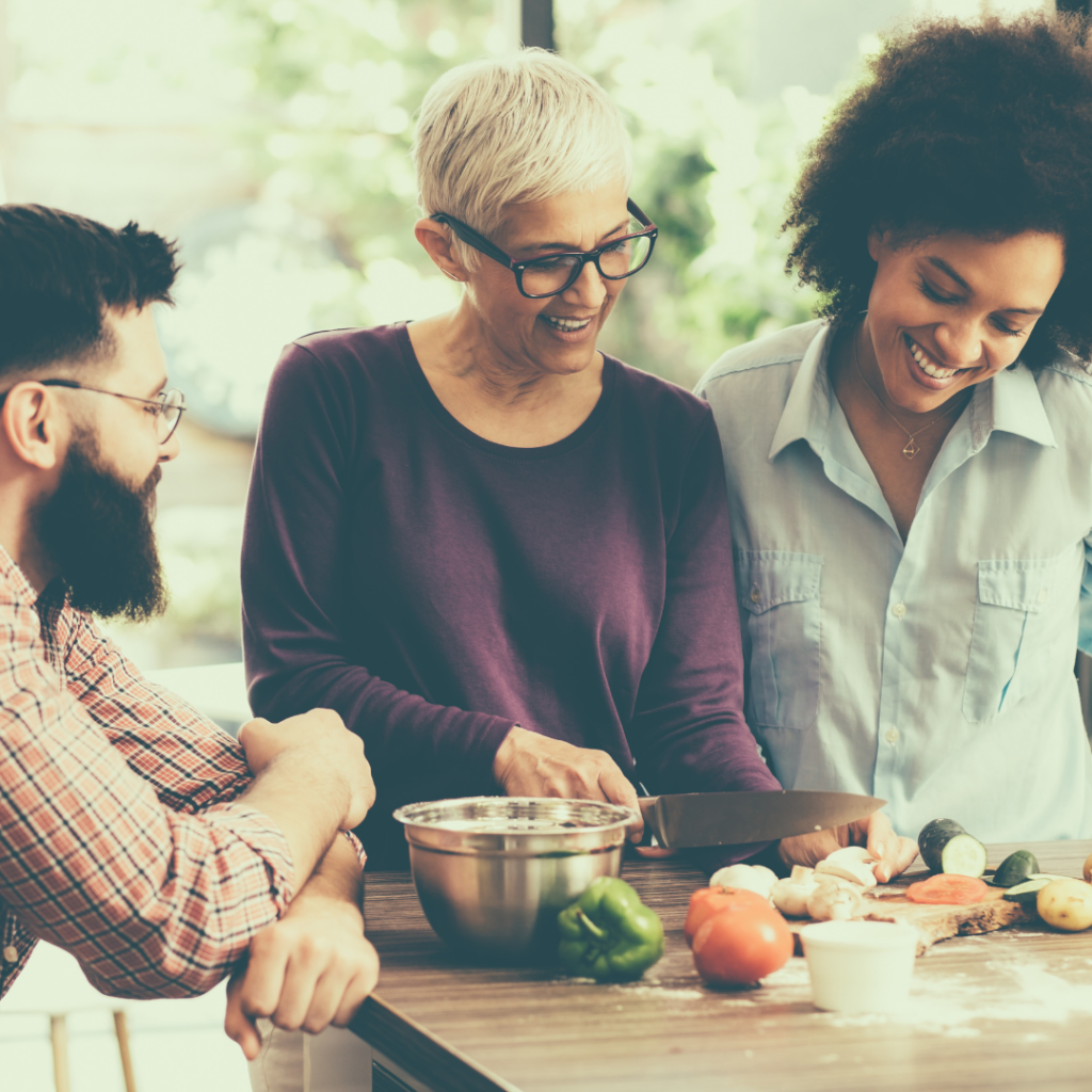 Three members of a family preparing food together